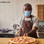 Man Wearing Slice Pizza for a Mask